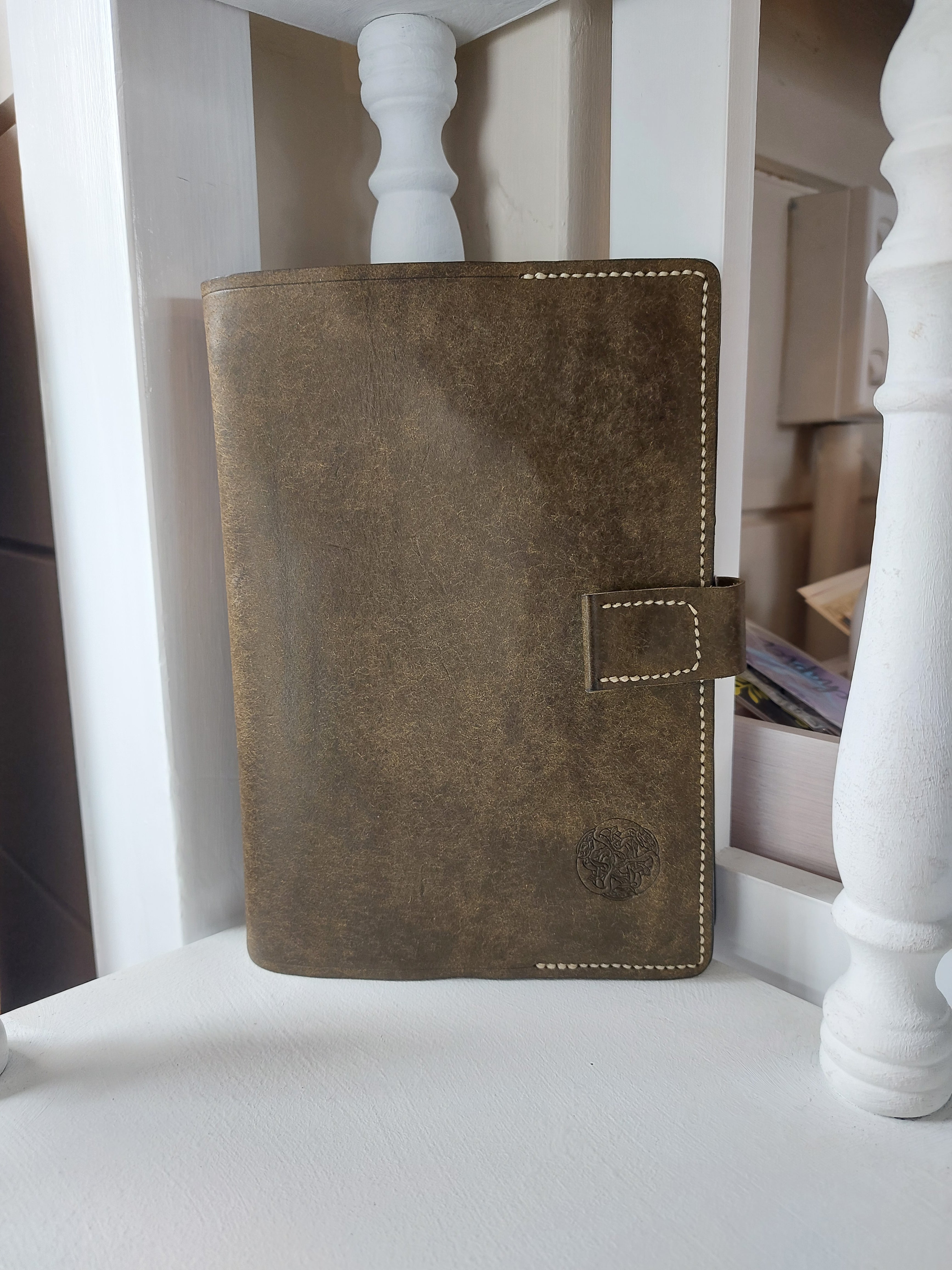 B6 Slip Cover & Notebook handmade from olive green vegetable-tanned cowhide leather, complete with lined notebook and magnetic closure.