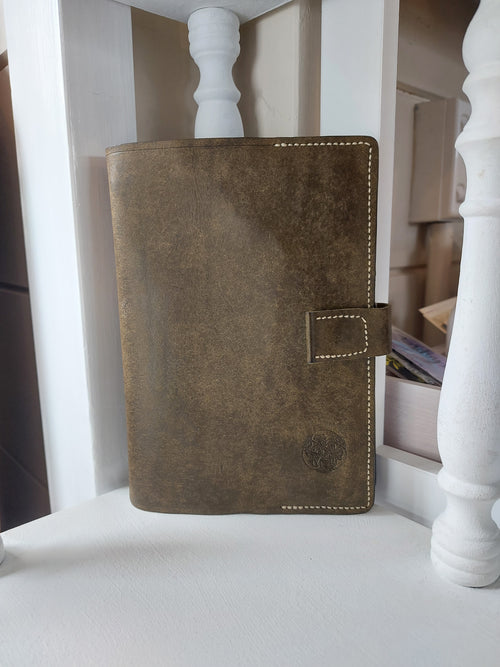B6 Slip Cover & Notebook handmade from olive green vegetable-tanned cowhide leather, complete with lined notebook and magnetic closure.
