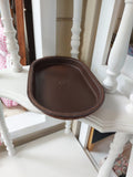 Oval Catch-All Tray handmade with Brown Kangaroo leather, created using the wet-forming technique. Stamped with the Albannach Crafts logo.