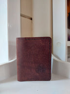 Card Case made from Chestnut Brown vegetable-tanned leather, and stamped with the Albannach Crafts logo.