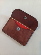 Minimalist Card & Coin Purse in Whiskey made with rich brown marble-effect leather, with the flap open.