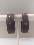 Red Studded Bracelet made with dark brown leather.