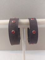 Red Studded Bracelet made with dark brown leather.
