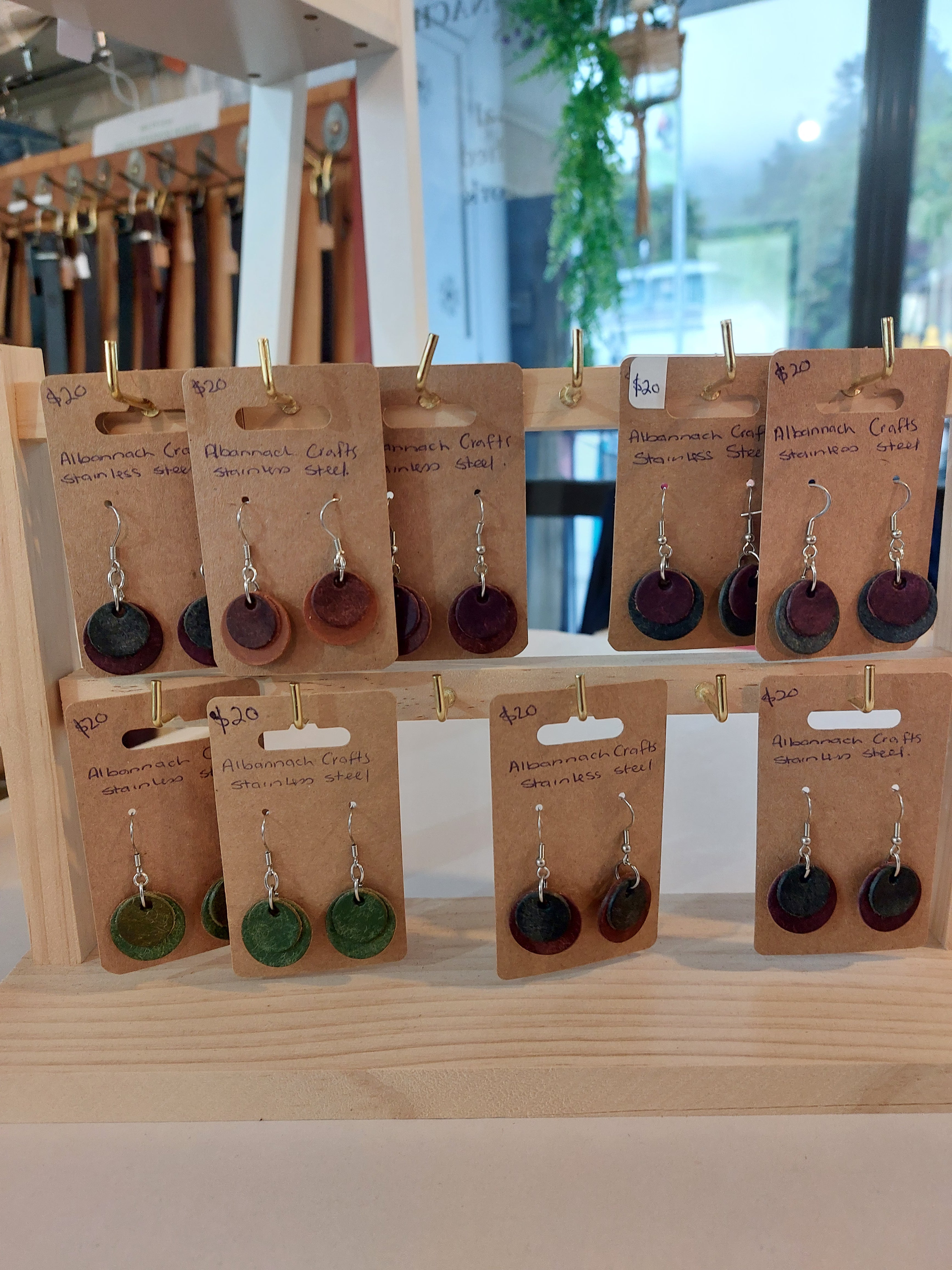 A collection of 9 Circle Earrings made from a variety of different colours of scrap leather. Complete with stainless steel fittings.