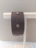Wide Band Bracelet with Copper Rivets, made with dark brown leather.
