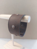 Side view of Wide Band Bracelet with Copper Rivets, made with dark brown leather.